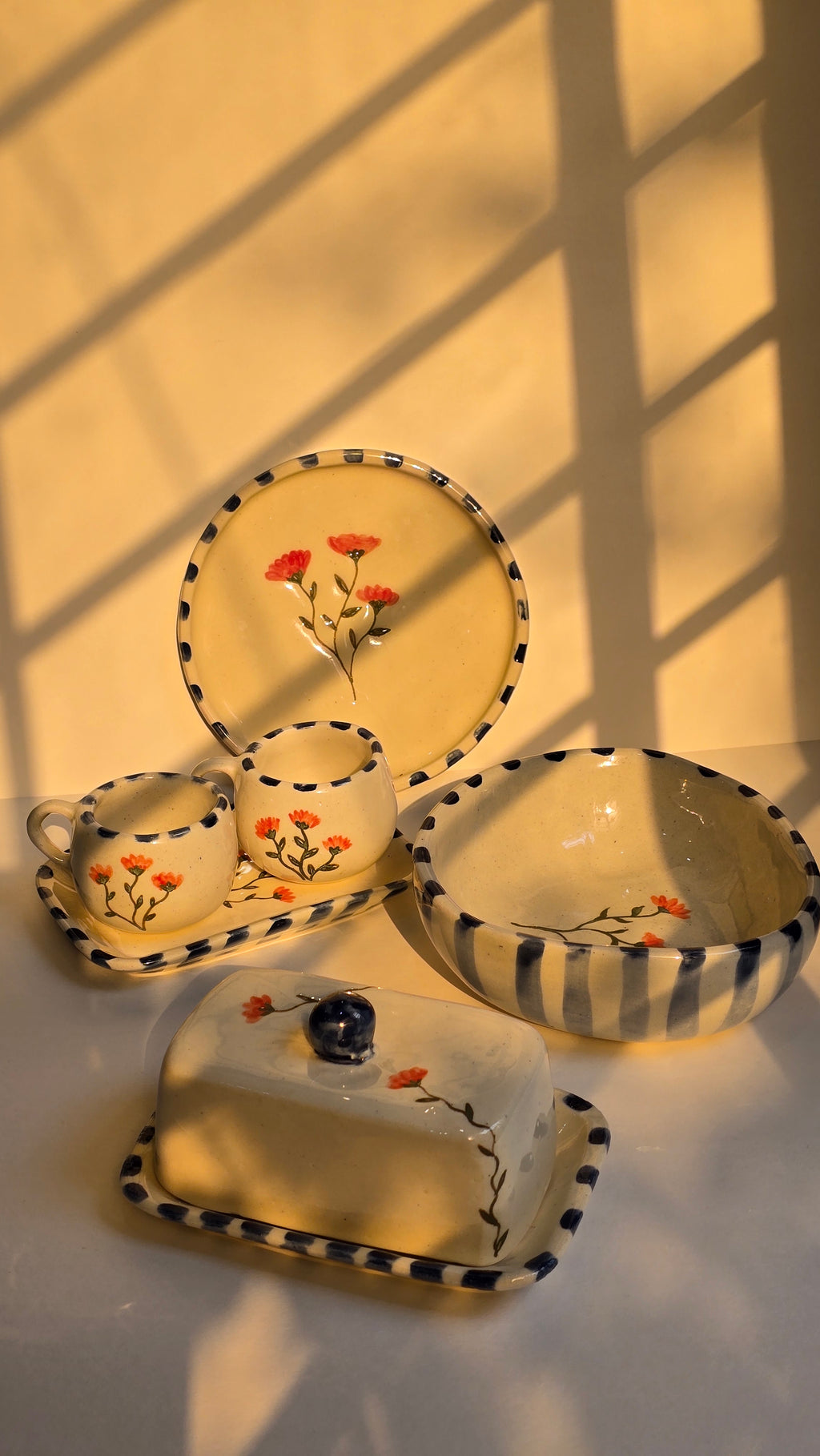 handmade ceramic breakfast set that includes floral design handpainted with love plates bowls butterdish cups and mugs