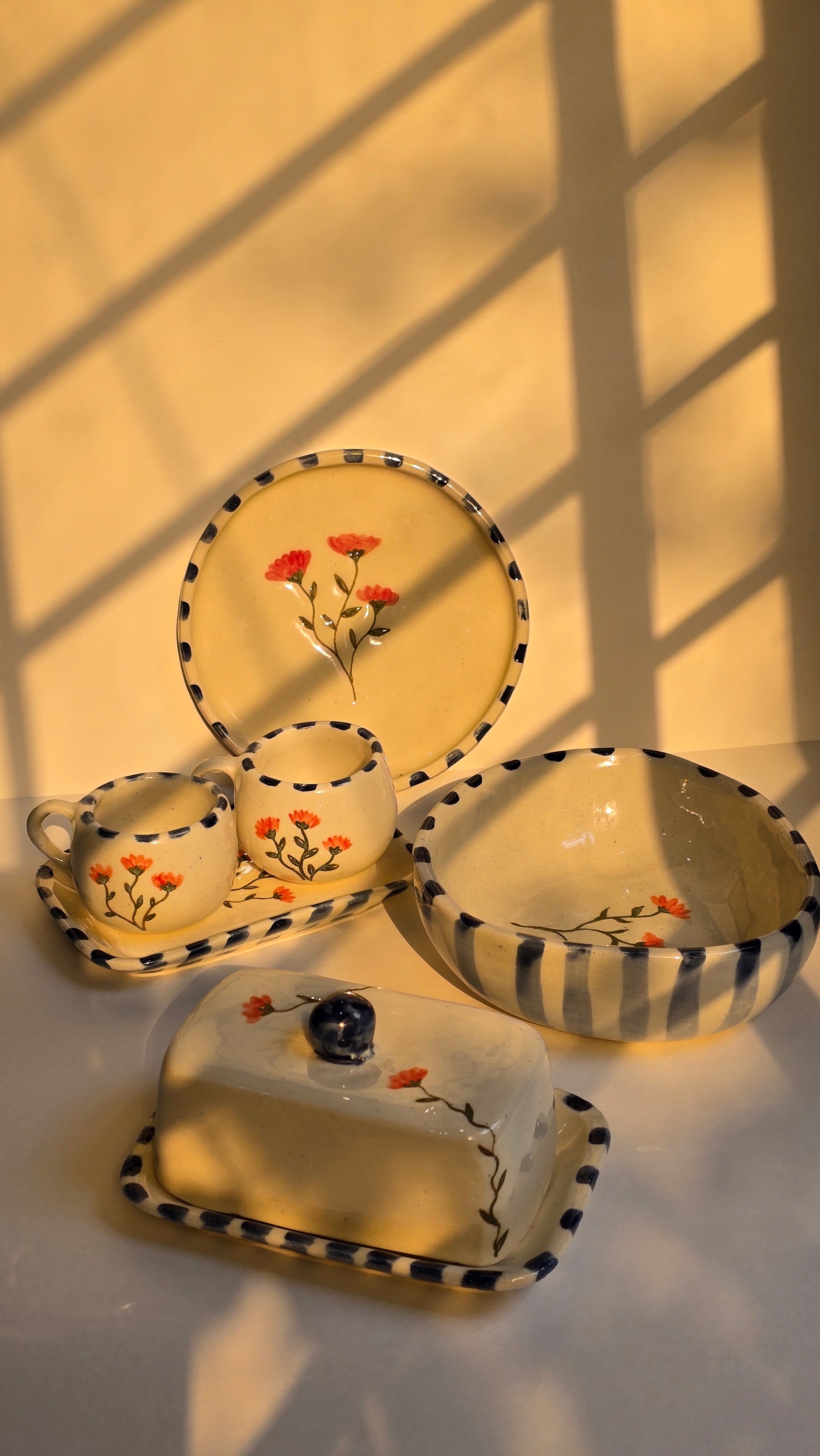 handmade ceramic breakfast set that includes floral design handpainted with love plates bowls butterdish cups and mugs