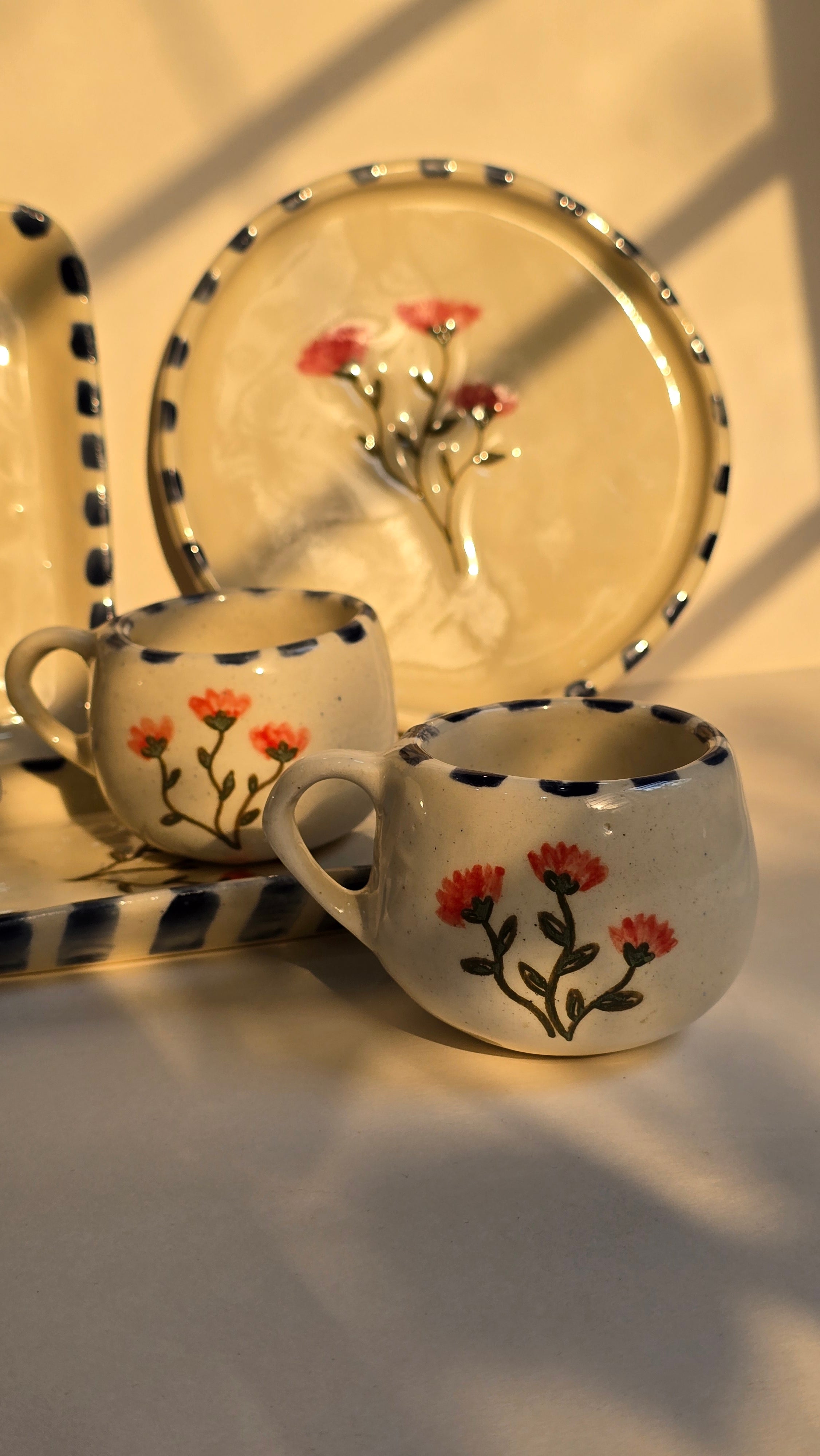 handmade ceramic breakfast set that includes floral design handpainted with love plates bowls butterdish cups and mugs