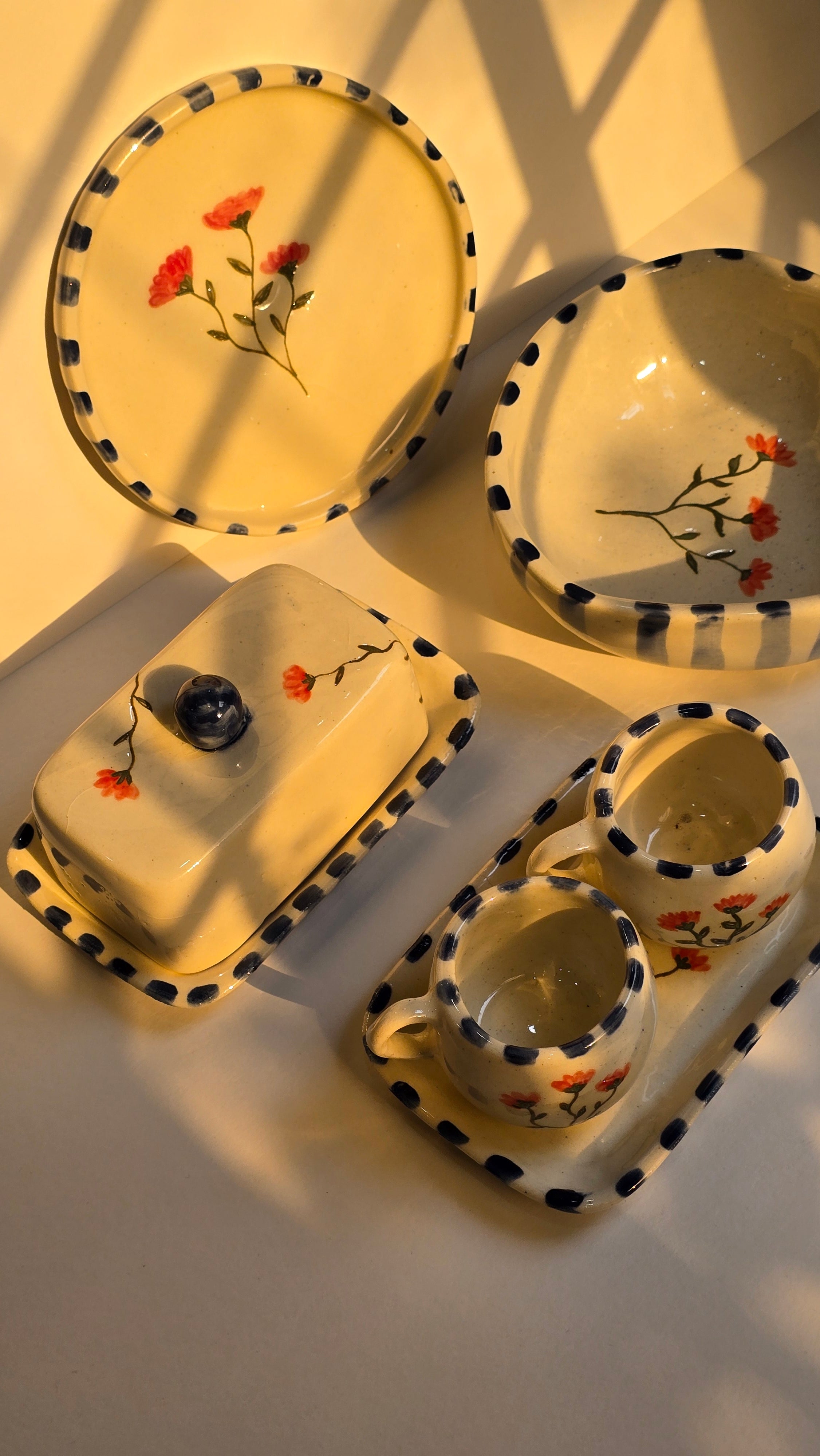 handmade ceramic breakfast set that includes floral design handpainted with love plates bowls butterdish cups and mugs