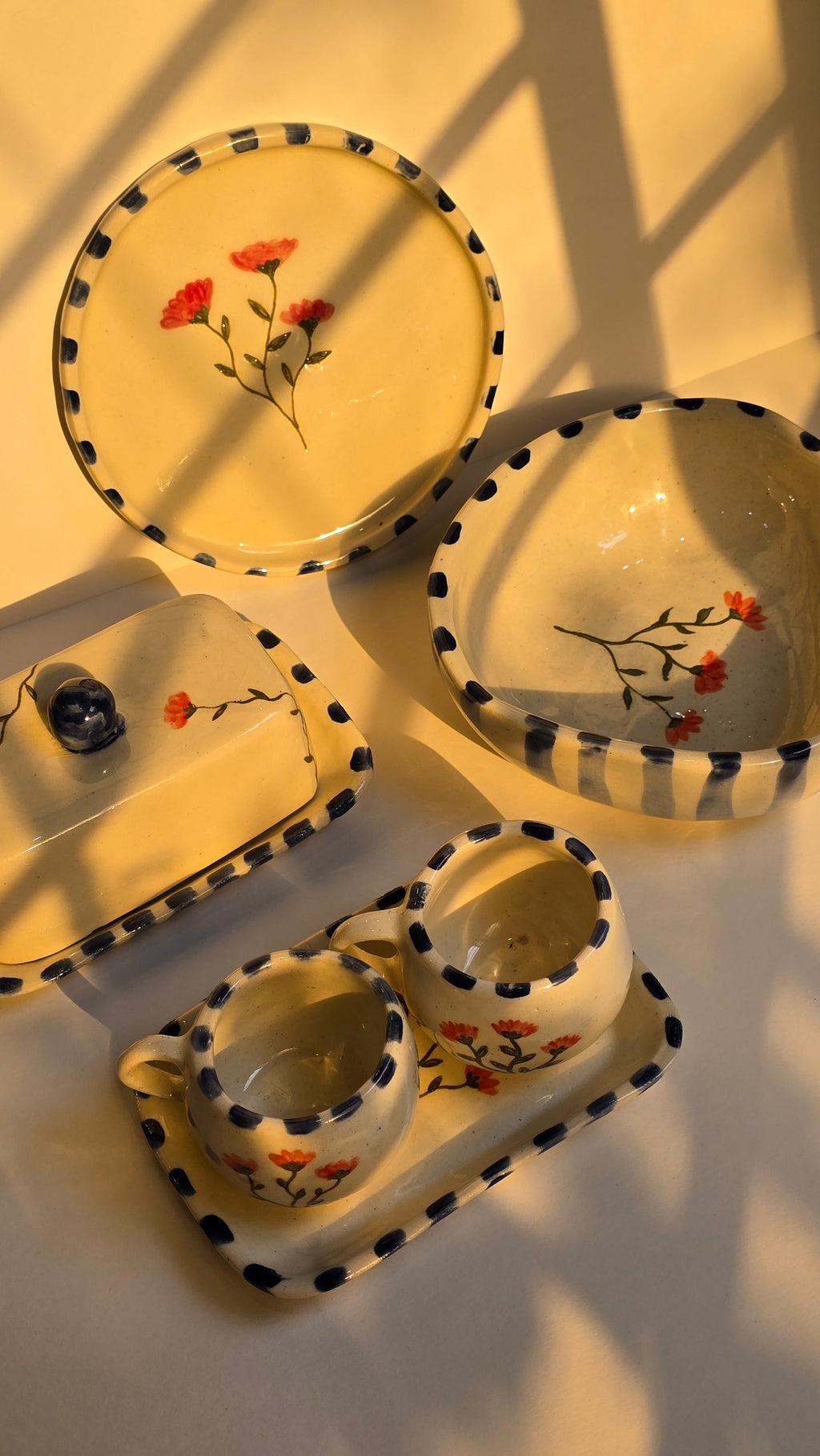 handmade ceramic breakfast set that includes floral design handpainted with love plates bowls butterdish cups and mugs