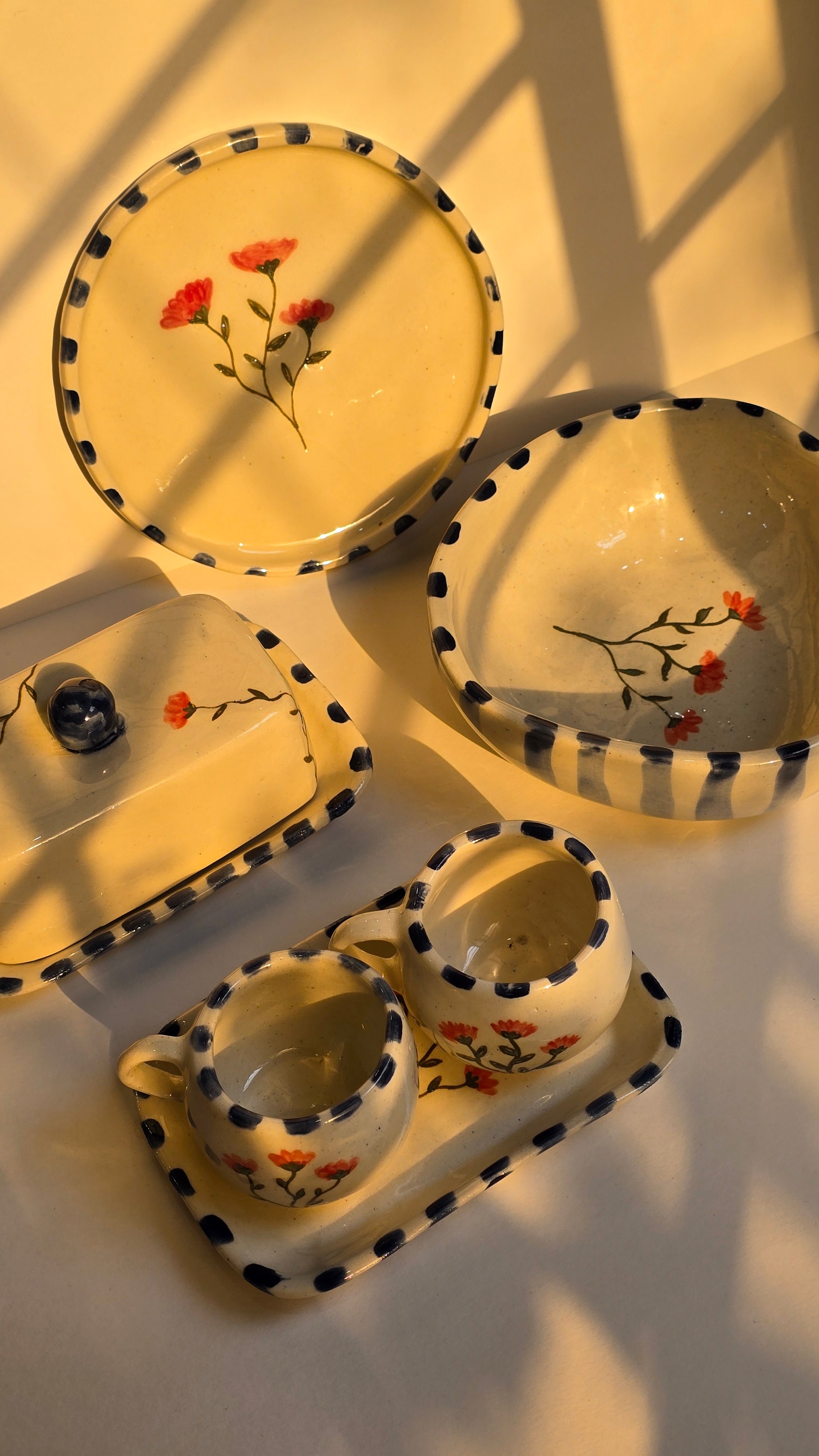 handmade ceramic breakfast set that includes floral design handpainted with love plates bowls butterdish cups and mugs