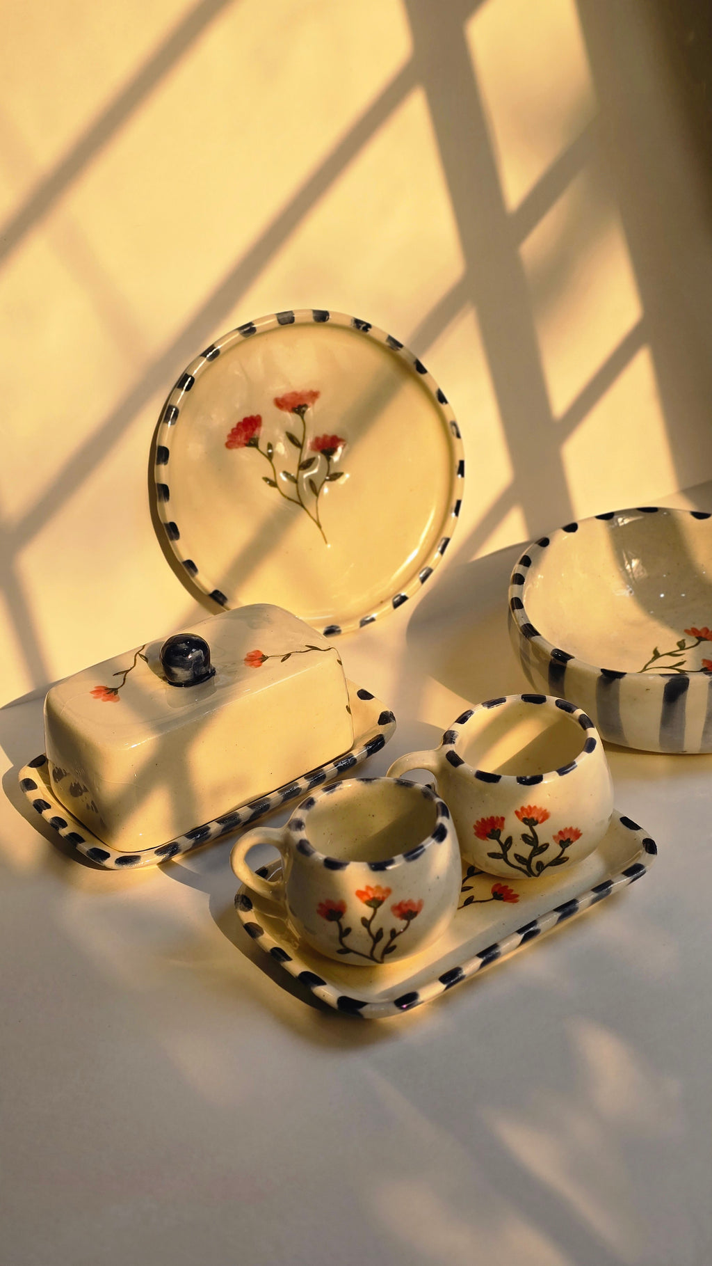 handmade ceramic breakfast set that includes floral design handpainted with love plates bowls butterdish cups and mugs