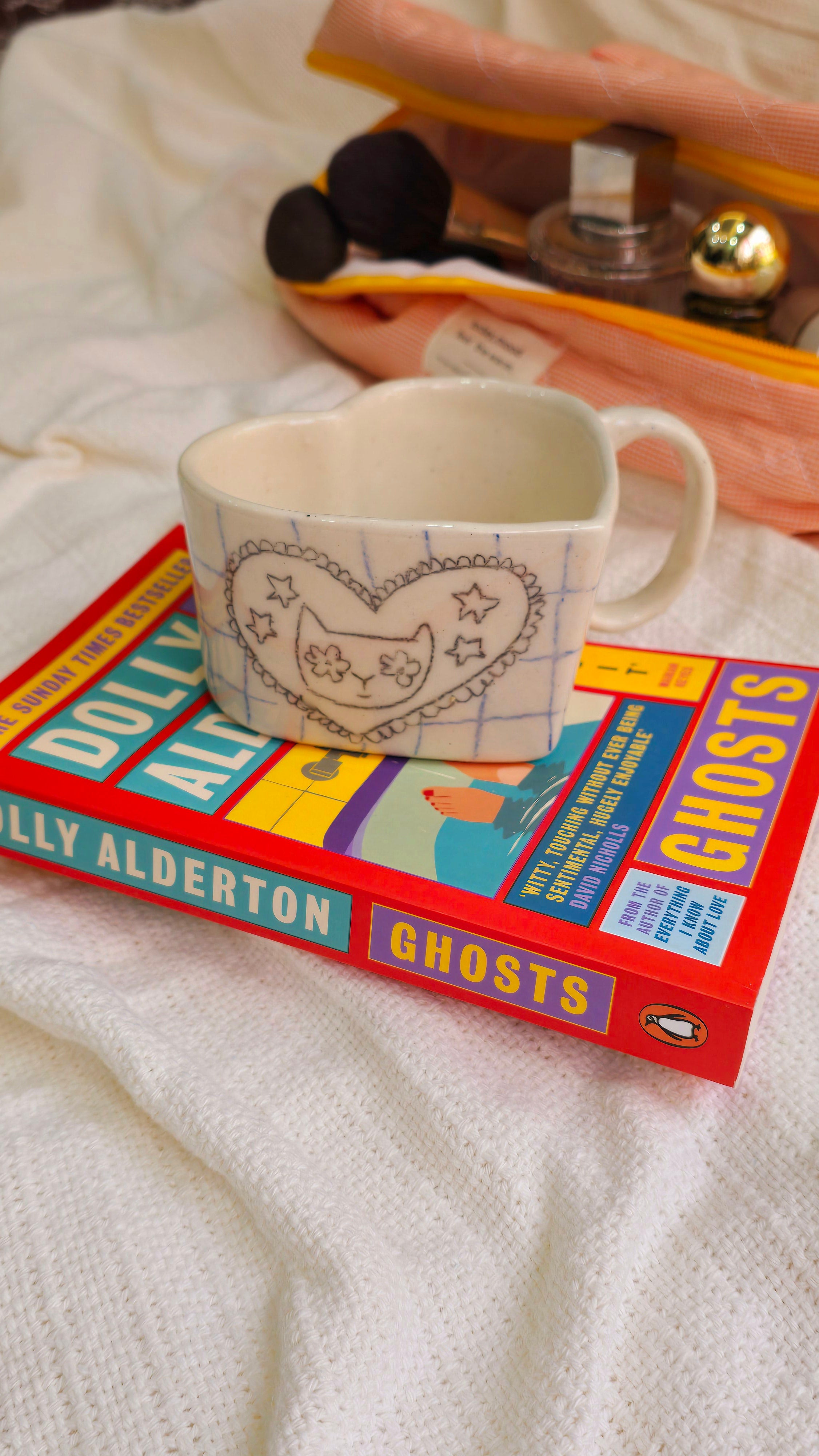 handmade ceramic hand-painted with aweird cat and it is heart shaped mug with pinteresty vibe