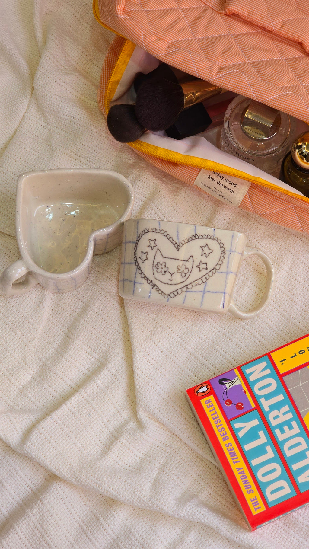 handmade ceramic hand-painted with aweird cat and it is heart shaped mug with pinteresty vibe