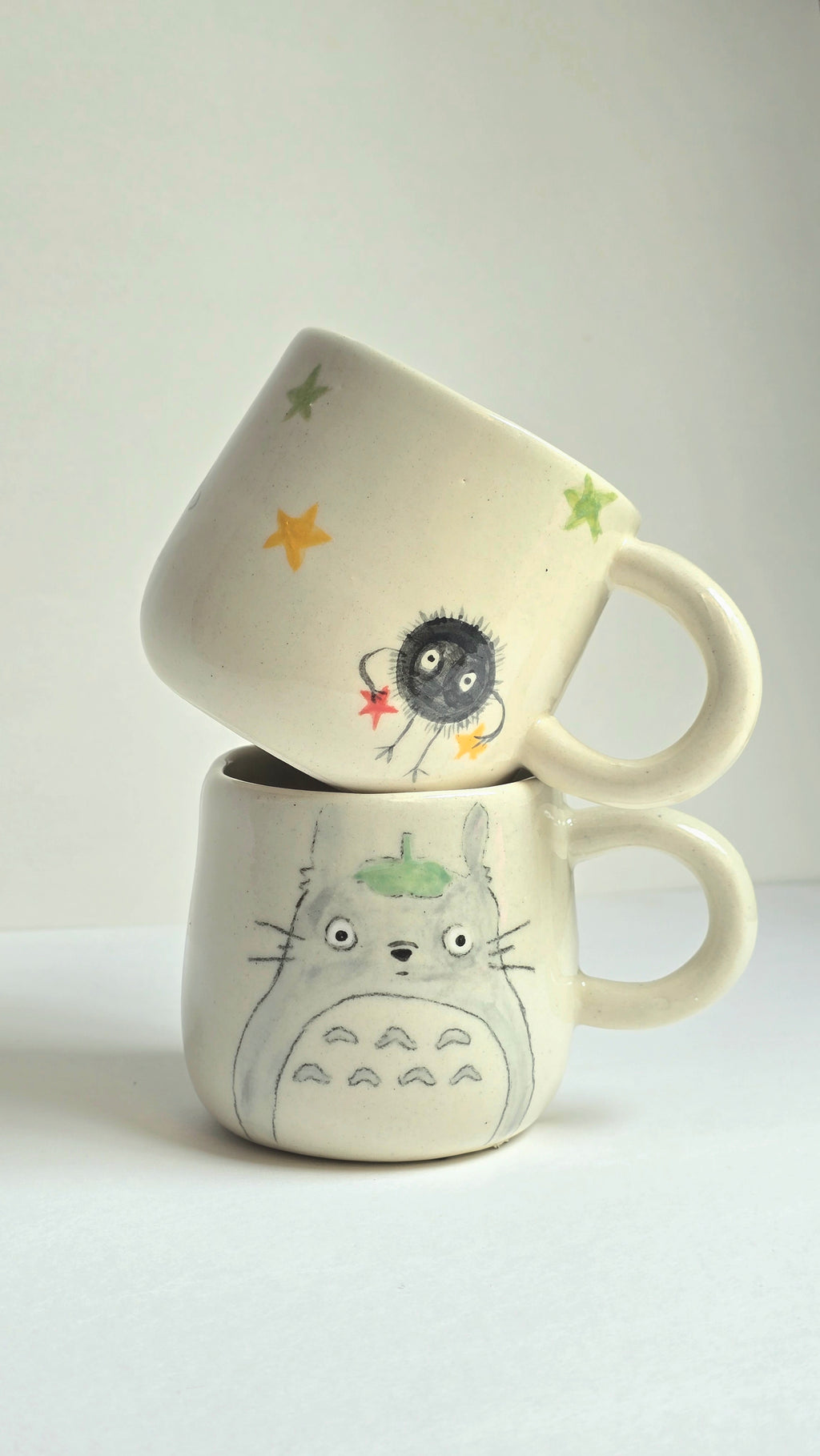 handmade ceramic ghibli inspired mugs with totoro and soots and perfect for collectors