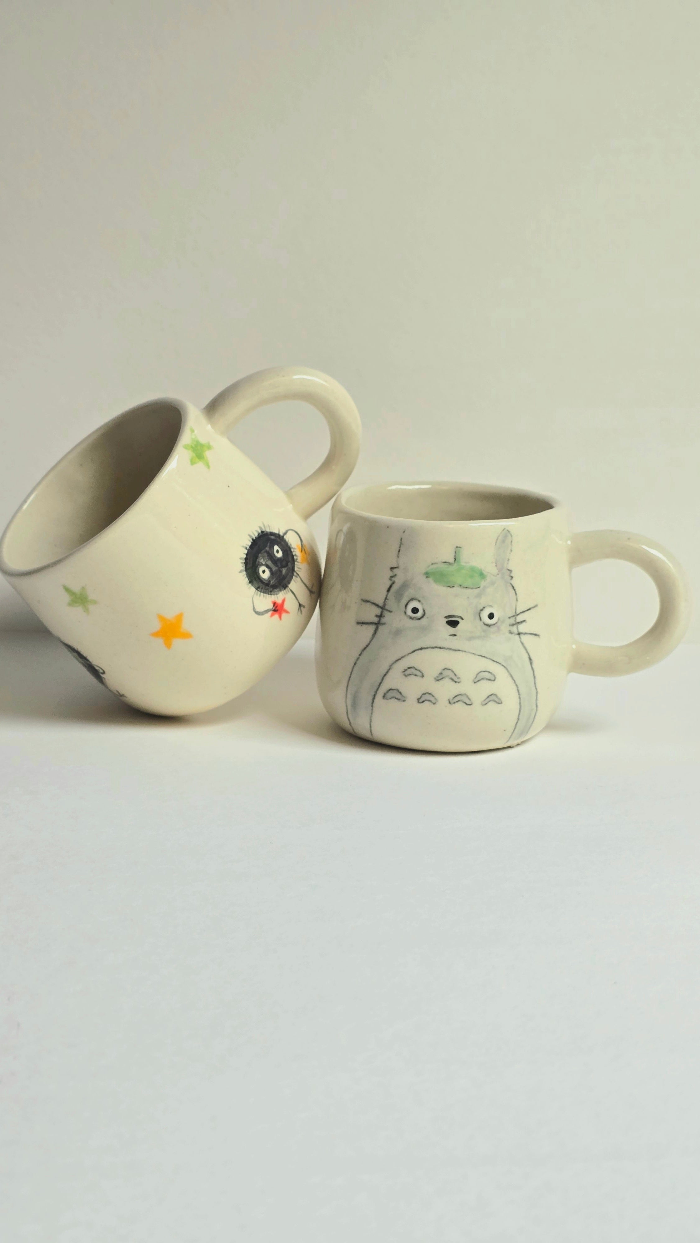 handmade ceramic ghibli inspired mugs with totoro and soots and perfect for collectors