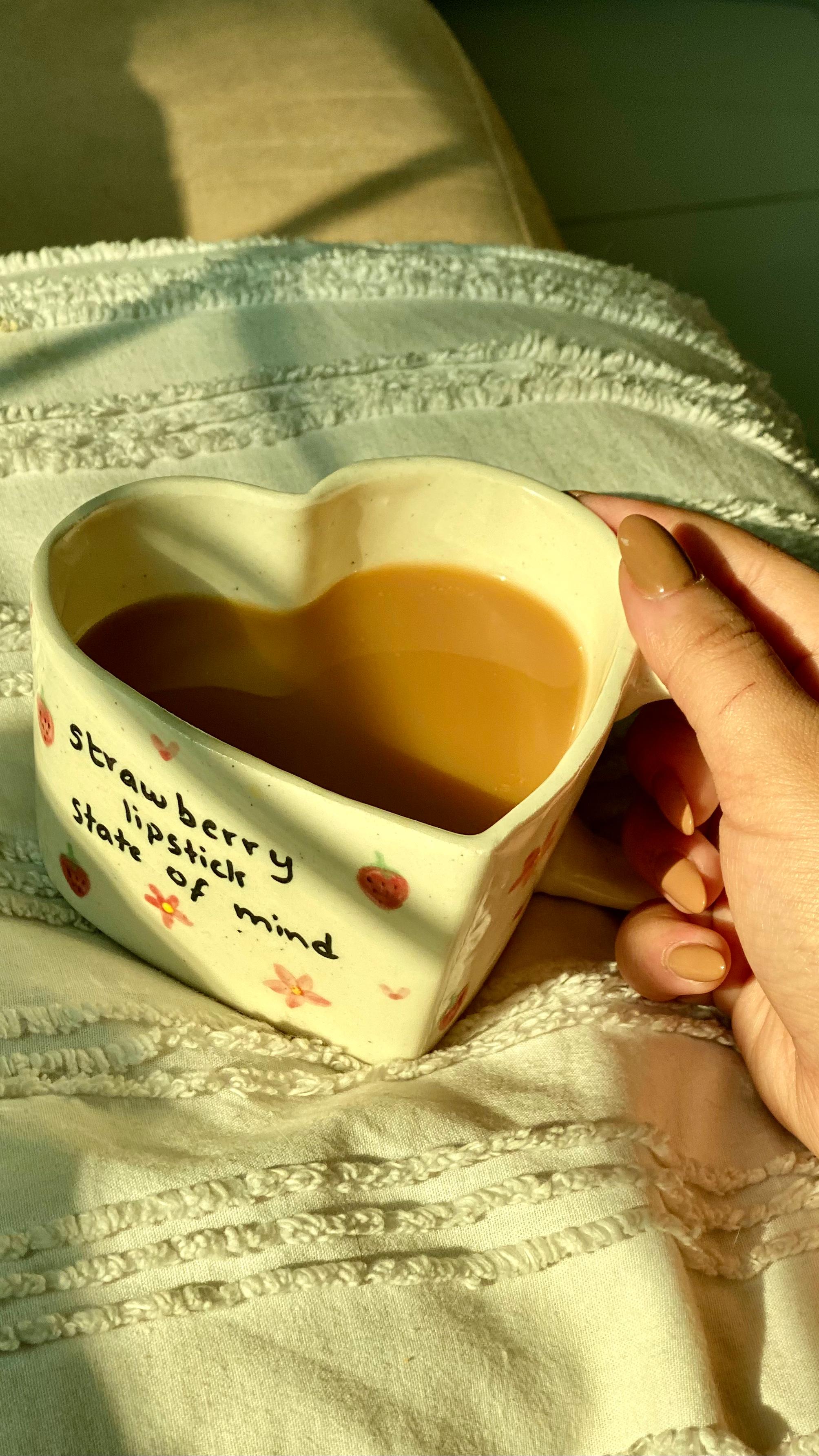 A heart-shaped ceramic mug with text on it best for bespoke gifting handpainted in pakistan by pastel jade ceramic studio it is microwave safe foodgrade and fired at high temperature in gas furnace