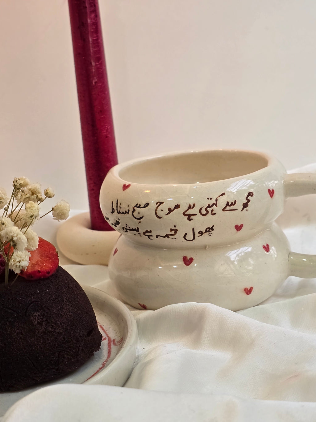 handmade and handpainted ceramic mug with urdu song and poetry perfect for gifting on valentines day and other occasions made by pastel jade ceramic studio in pakistan it is oven safe and foodgrade fired at high temperature in gas furnace made with stoneware clay and leadfree glaze