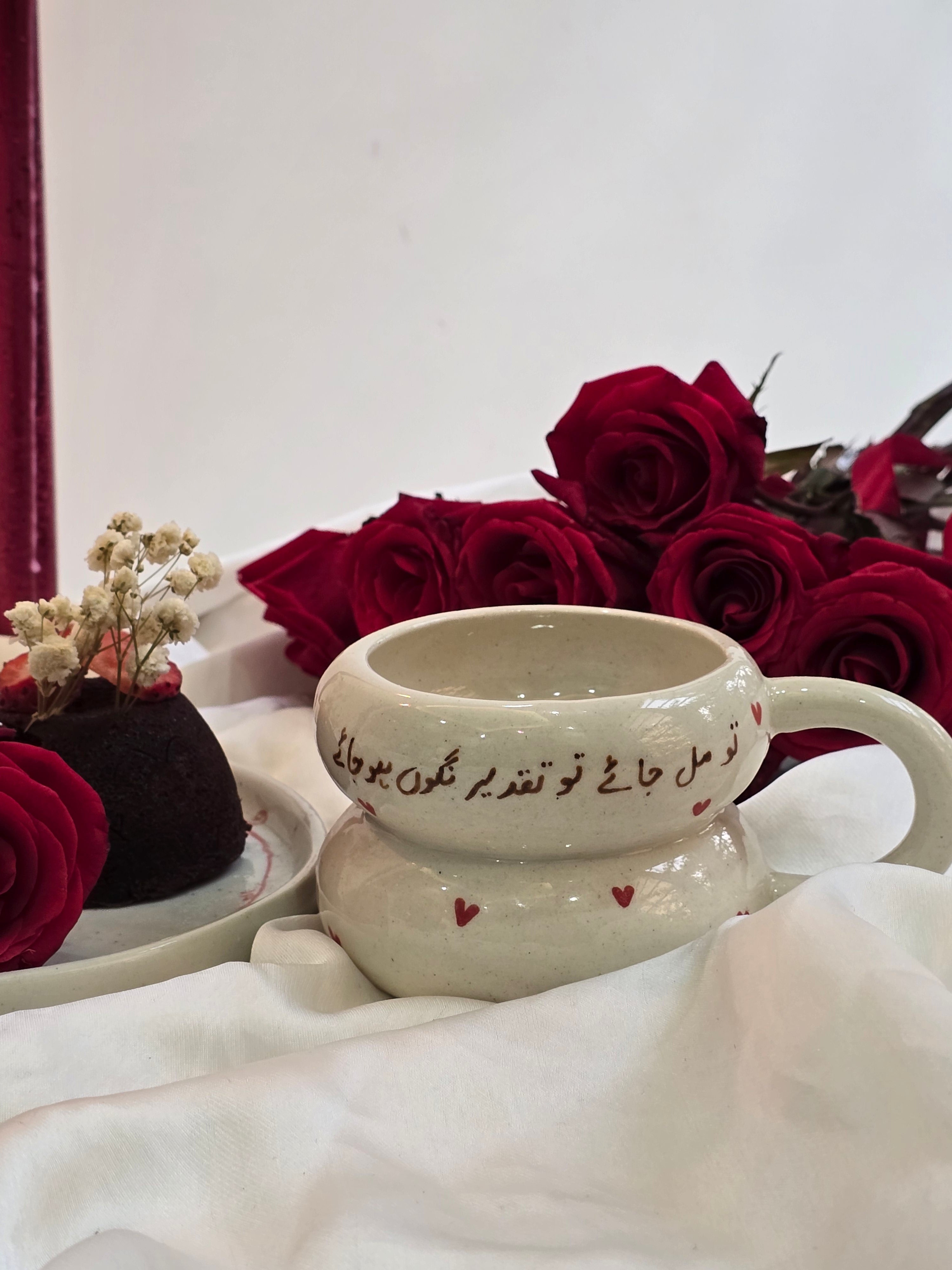 handmade and handpainted ceramic mug with urdu song and poetry perfect for gifting on valentines day and other occasions made by pastel jade ceramic studio in pakistan it is oven safe and foodgrade fired at high temperature in gas furnace made with stoneware clay and leadfree glaze 